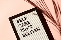 A signboard that says self care isn't selfish